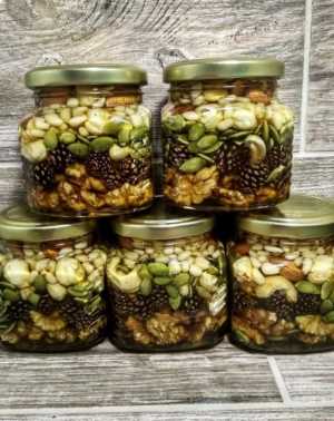 Мед с орехами и шишкой.